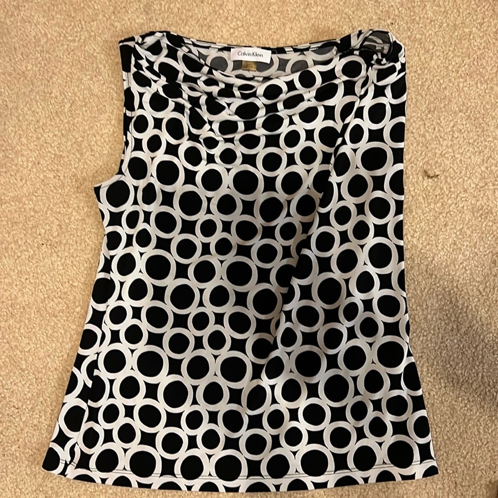 This is a medium women’s shirt by Calvin Klein